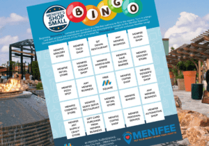 A bingo card titled "Shop Small" showcases local businesses in Menifee, set against the backdrop of an inviting outdoor fire pit and seating area on a sunny day. I'm sorry, but there doesn't seem to be any additional content needed for SEO keywords.